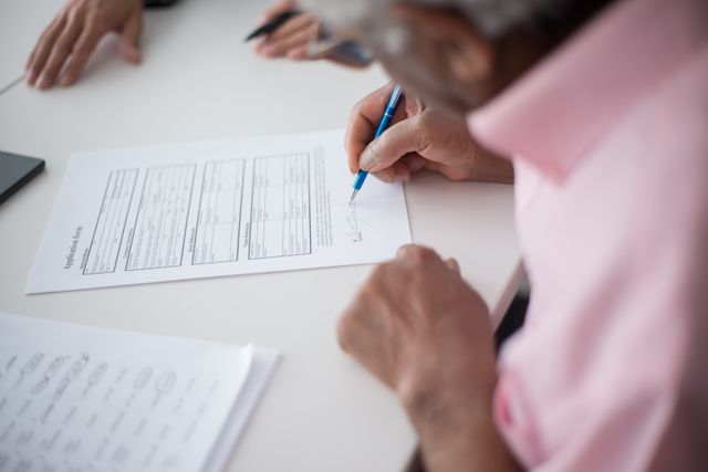 a person filling out an application form