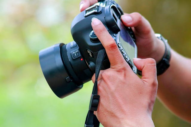a person holding a camera