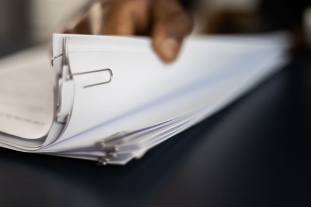 a person looking through documents