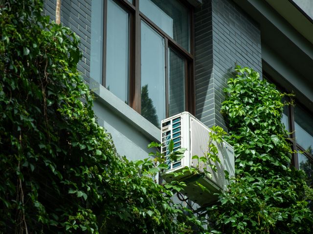 an HVAC unit on the exterior wall of a building
