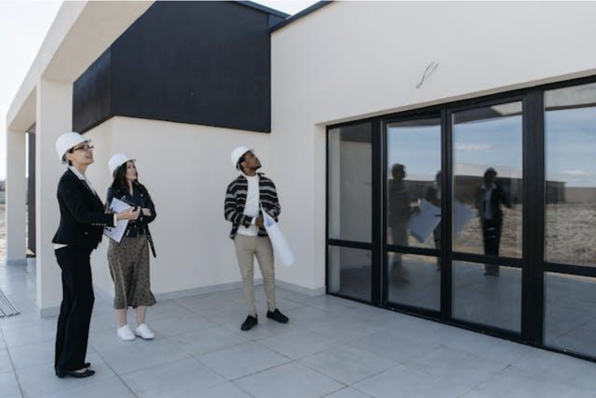 a landlord and tenants inspecting a property